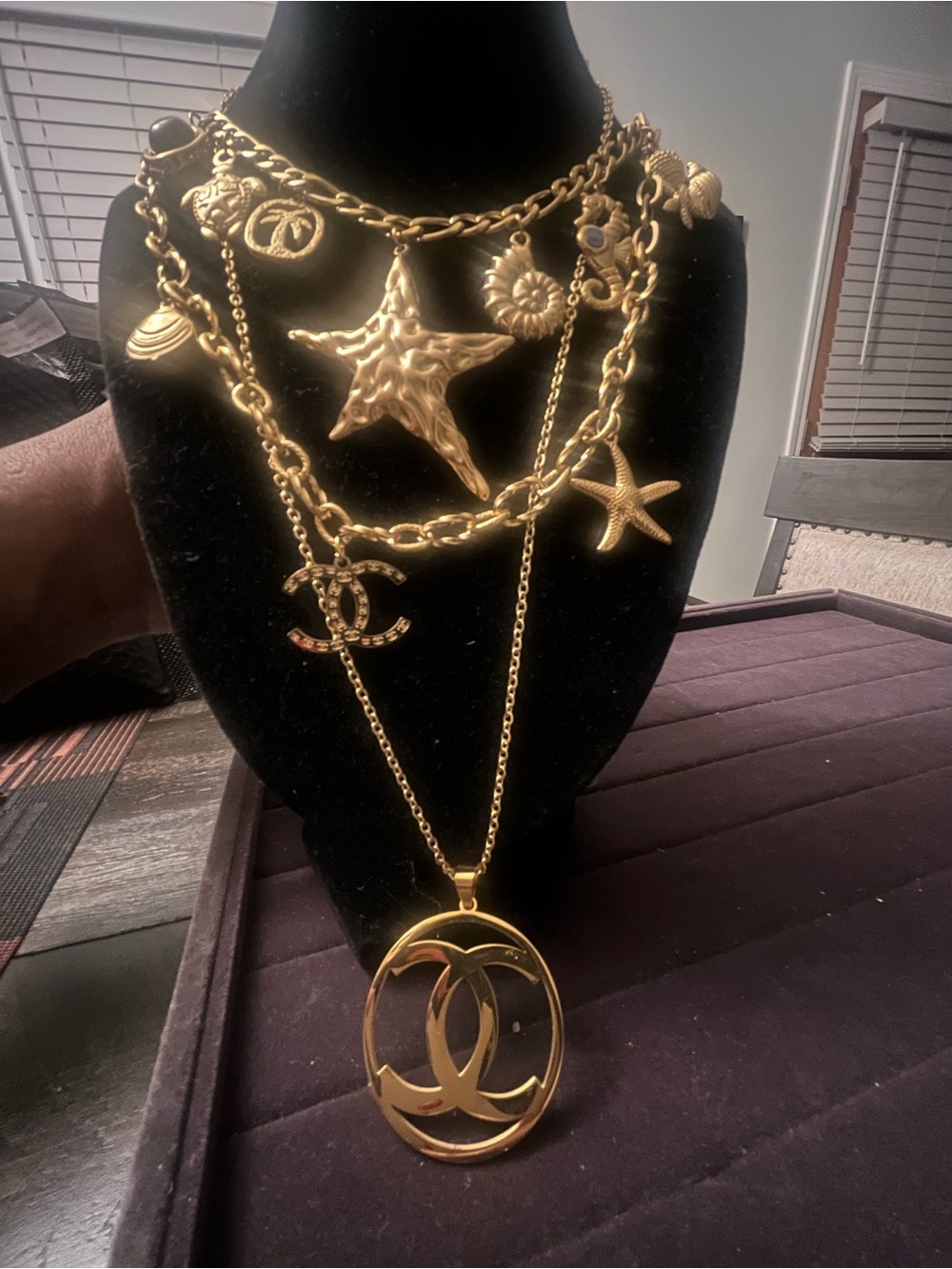 Gold-Tone Multi-Layer Charm Necklace with Starfish & Interlocking Logo Pendant